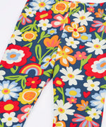 Close up of the Frugi libby beautiful bunch printed organic cotton leggings. Navy coloured background with all over flower print.