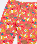 Close up of the Frugi libby pink organic cotton  leggings with an all over guinea pig muddle print. 