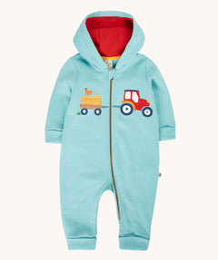 Frugi soft green all in one organic cotton zip suit with tractor and trailer applique on the front and red lining inside. The front zip extends from the neck down to the ankle.