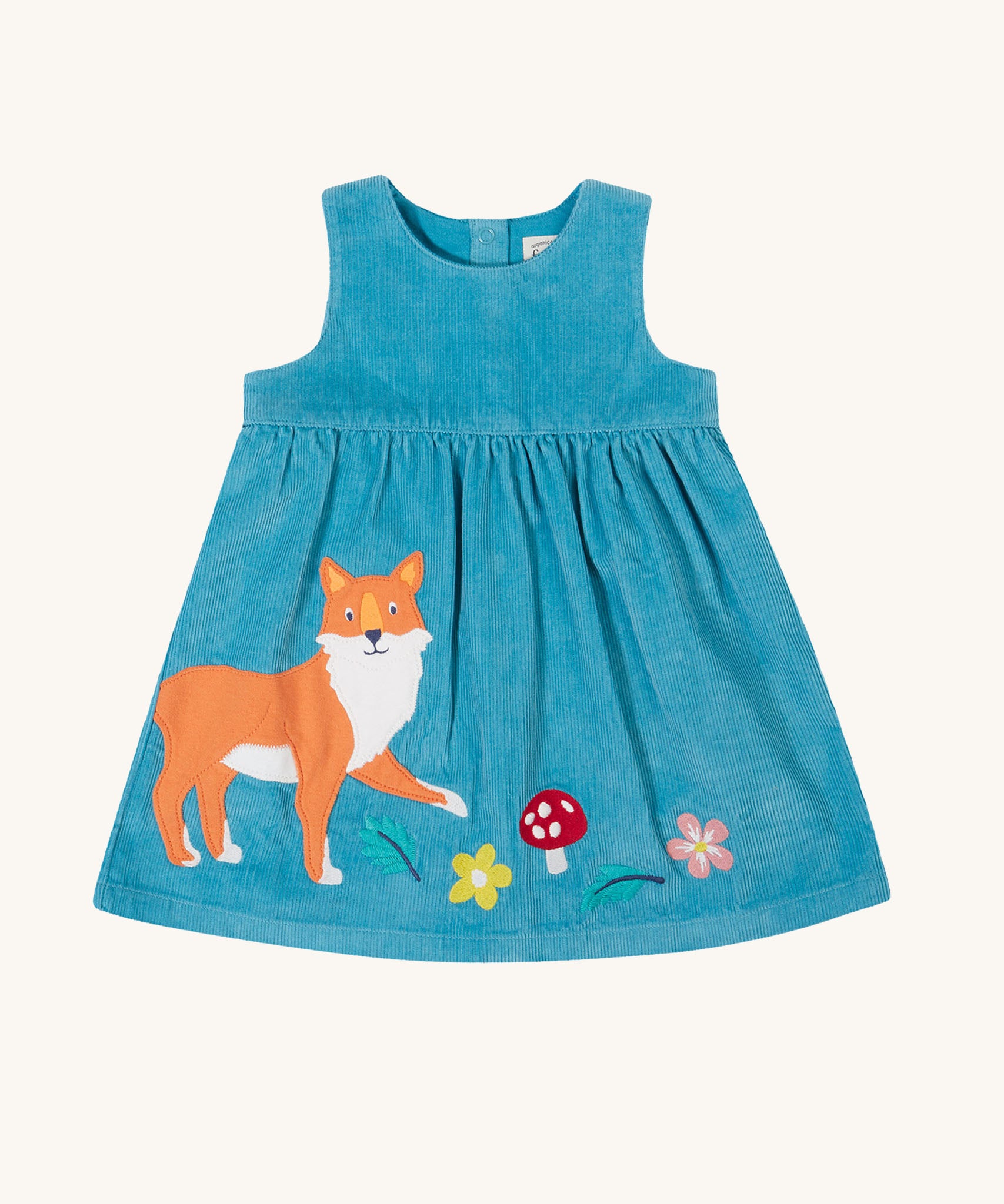 The Frugi Lily blue organic cotton cord children's dress with fox, mushroom and flowers appliques on the front.