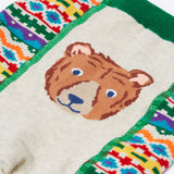 A close up of the brown bear on the bottom of the Frugi organic cotton little knitted fair isle leggings.
