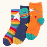 Frugi little roly bamboo socks in a 3 pack with space edesign. Rainbow stripe with white star pair, navy with planet pair and an orange with rainbow stars pair.