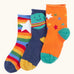Frugi little roly bamboo socks in a 3 pack with space edesign. Rainbow stripe with white star pair, navy with planet pair and an orange with rainbow stars pair.