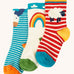 Frugi little organic cotton socks organic cotton 3 pack. One blue and white stripes with a bow on the front, one red and white striped pair with a sheep on the side and a white pair with a rainbow on the side
