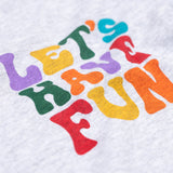 A close up of the text on the front of the Frugi Adventure Organic Cotton Printed Kids' grey Top.