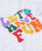 A close up of the text on the front of the Frugi Adventure Organic Cotton Printed Kids' grey Top.