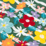 A super close up view of the Frugi Louise embroidered heart holly green breton stripe long sleeved top.  