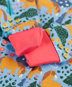 Close up of the pink fold offer scrath mitt cuffs on the Frugi lovely baby gift set featuring wild shetland design on a babygrow .