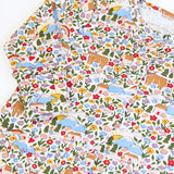 Close up of the print on the Frugi lovely babygrow with an all over highland fields print. 