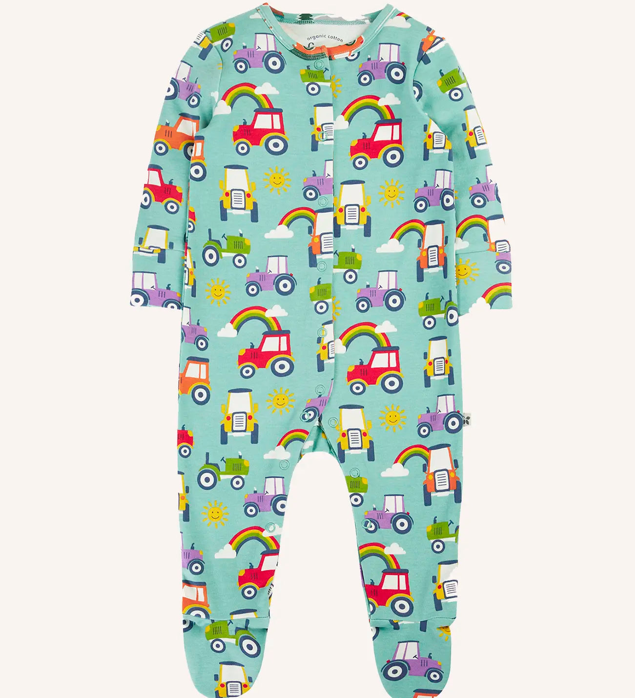 Frugi organic cotton lovely babygrow sleepsuit with an all over terrific tractors print on a blue background. 