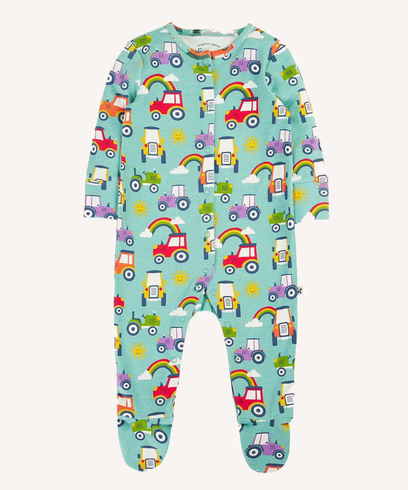 Frugi organic cotton lovely babygrow sleepsuit with an all over terrific tractors print on a blue background. 