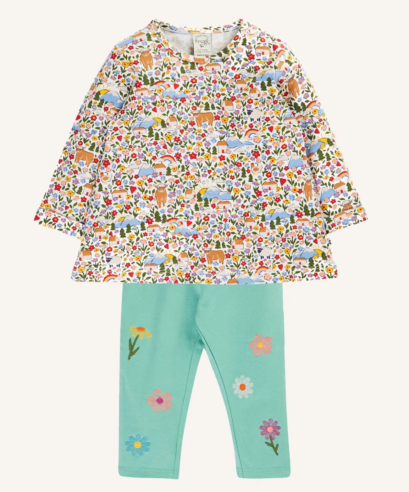 Frugi mabel outfit with moss green trousers with flowers and a highland fields print long sleeved top.