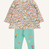 Frugi mabel outfit with moss green trousers with flowers and a highland fields print long sleeved top.