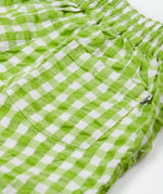 Close up of the Frugi kids macaw gingham Giles short showing the back pocket detail on green gingham organic cotton fabric