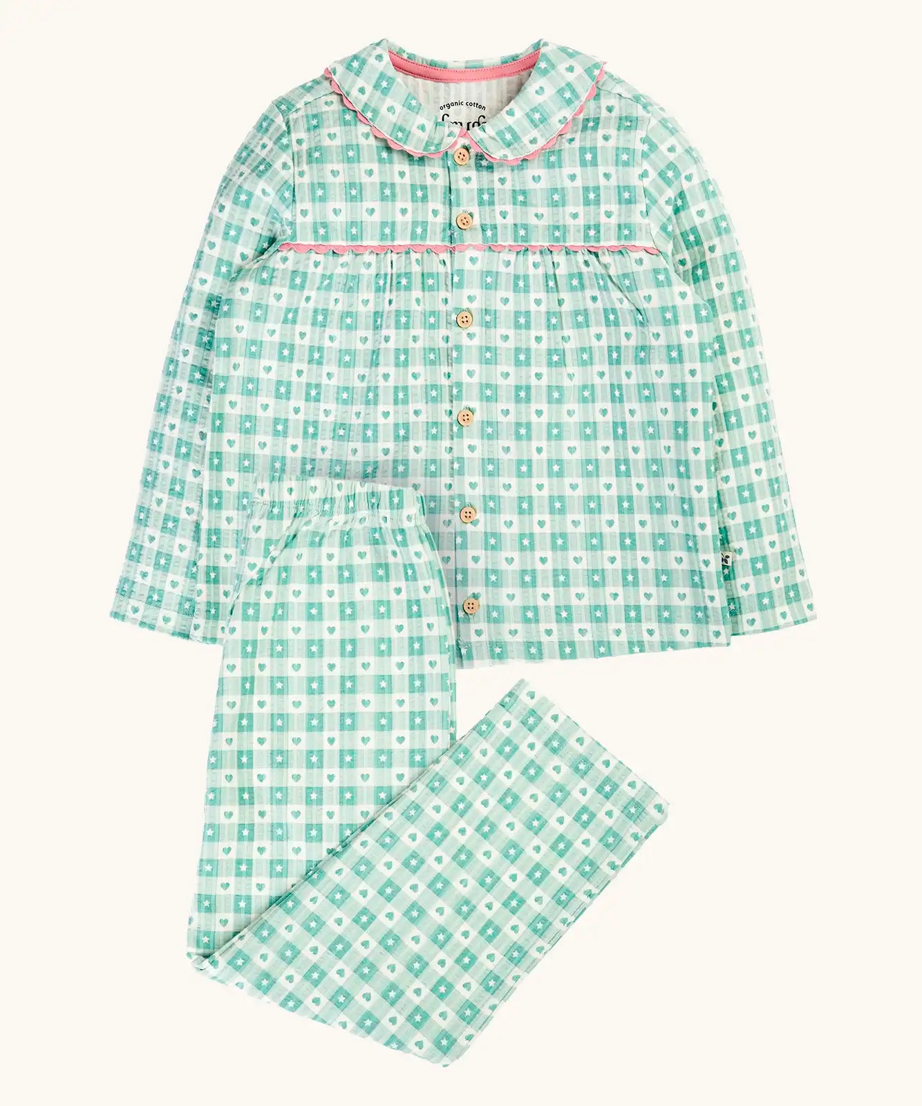 Frugi magic nights organic cotton hayley traditional pyjamas. Light green and white check style with hearts and stars. Pink frill around the collar and across the chest.