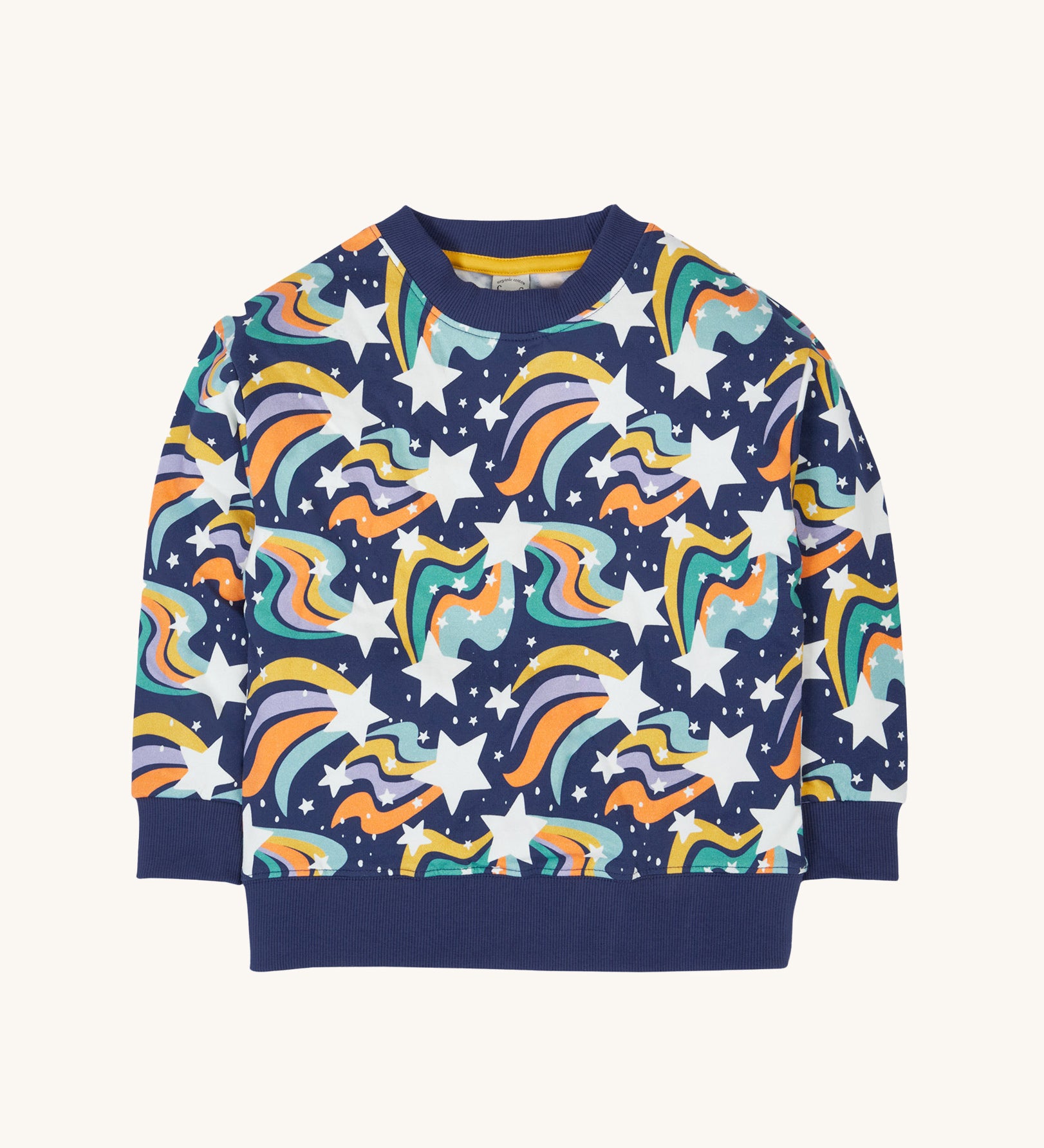 Frugi child's Organic Cotton Mawnan Jumper with a Magic Skies print. A navy background with white stars and rainbow swirls all over. This jumper is a part of a wide range of organic cotton clothing for children available here at Babipur. 