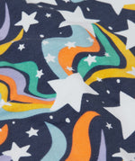 A close up of the print on the Frugi child's Organic Cotton Mawnan Jumper with a Magic Skies print. A navy background with white stars and rainbow swirls all over. This jumper is a part of a wide range of organic cotton clothing for children available here at Babipur. 
