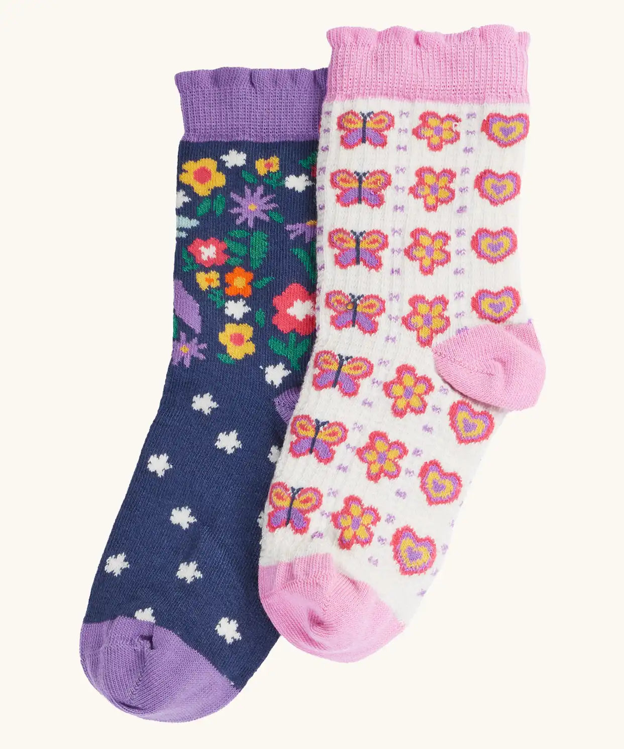 Frugi magical organic cotton frill socks 2 pack. One navy pair with flowers and a pegasus and a purple frill. One white pair with flowers and butterflies with pink frill.