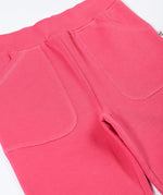 A close up of the pockets on the Frugi Malpas rose pink joggers.