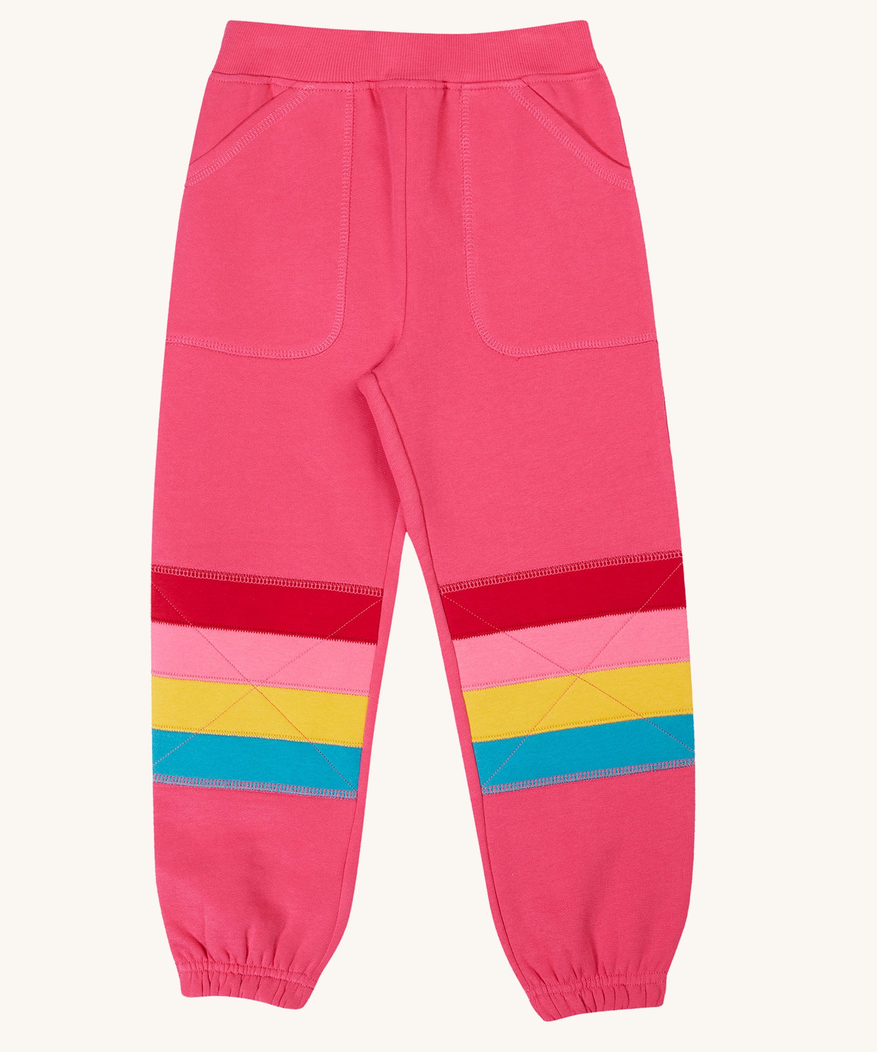 Frugi Malpas rose pink rainbow applique organic cotton joggers. The joggers coordinate with other items from Frugi's Autumn Winter range available at Babipur. 