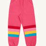Frugi Malpas rose pink rainbow applique organic cotton joggers. The joggers coordinate with other items from Frugi's Autumn Winter range available at Babipur. 