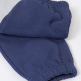 A close up of the navy block colour on the Frugi Malpas Placement Grey Joggers with Trucks.