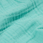 A close up of the Frugi Marco Outfit's shorts, in the colour Moss.