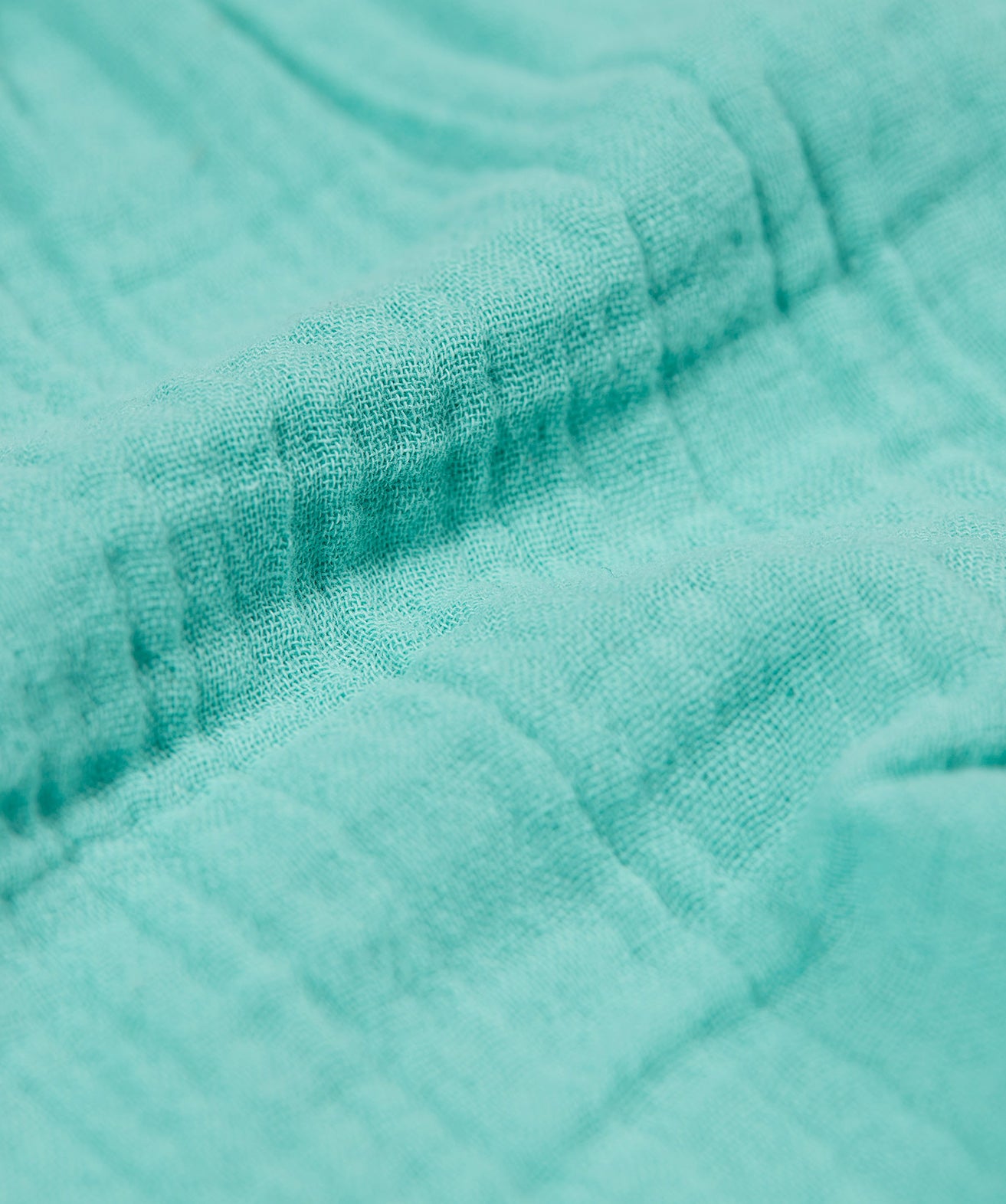 A close up of the Frugi Marco Outfit's shorts, in the colour Moss.