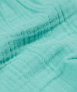 A close up of the Frugi Marco Outfit's shorts, in the colour Moss.