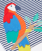 A close up of the Frugi Marco Outfit's t-shirt, in Navy Blue Stripe with an embroidered Parrot.
