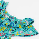 A close up of the Frugi Maris Playsuit, featuring a Sea Life print's frilly collar.