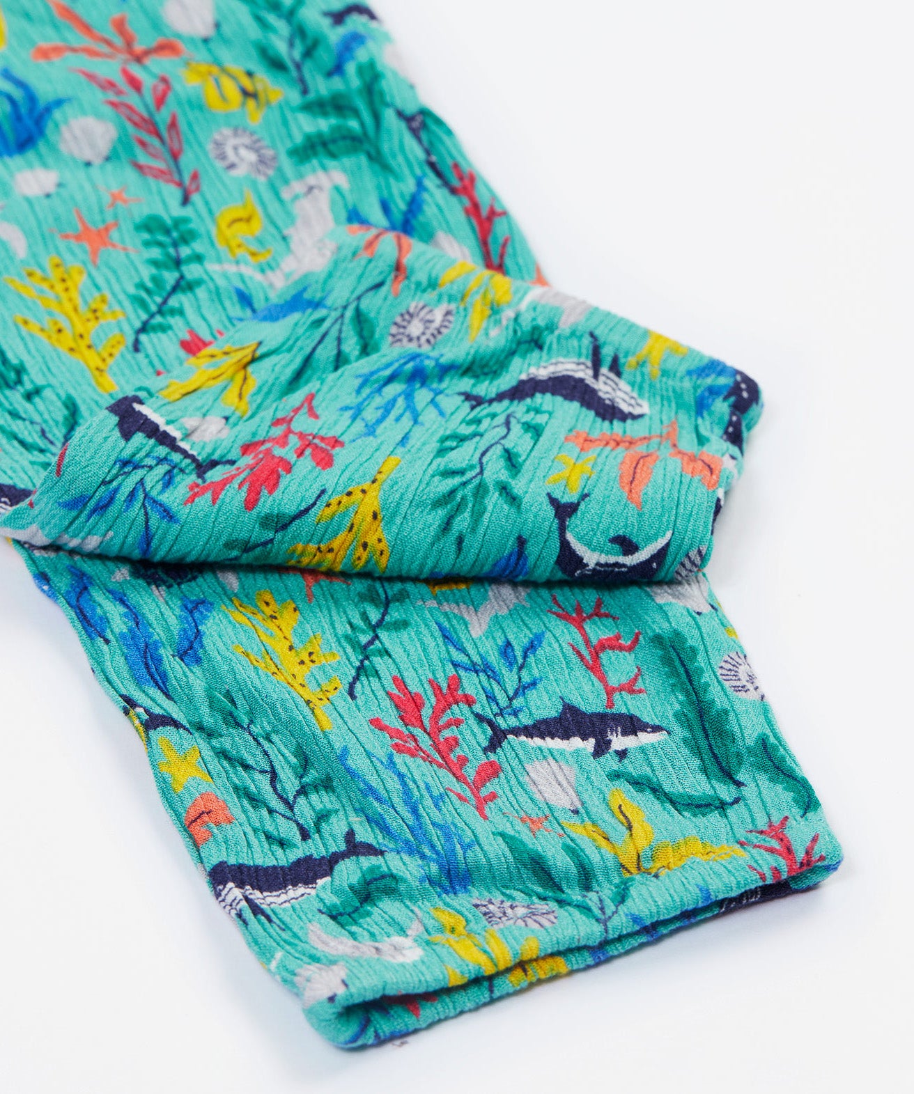Frugi Maris Playsuit, featuring a Sea Life, close up of the folded playsuit legs.