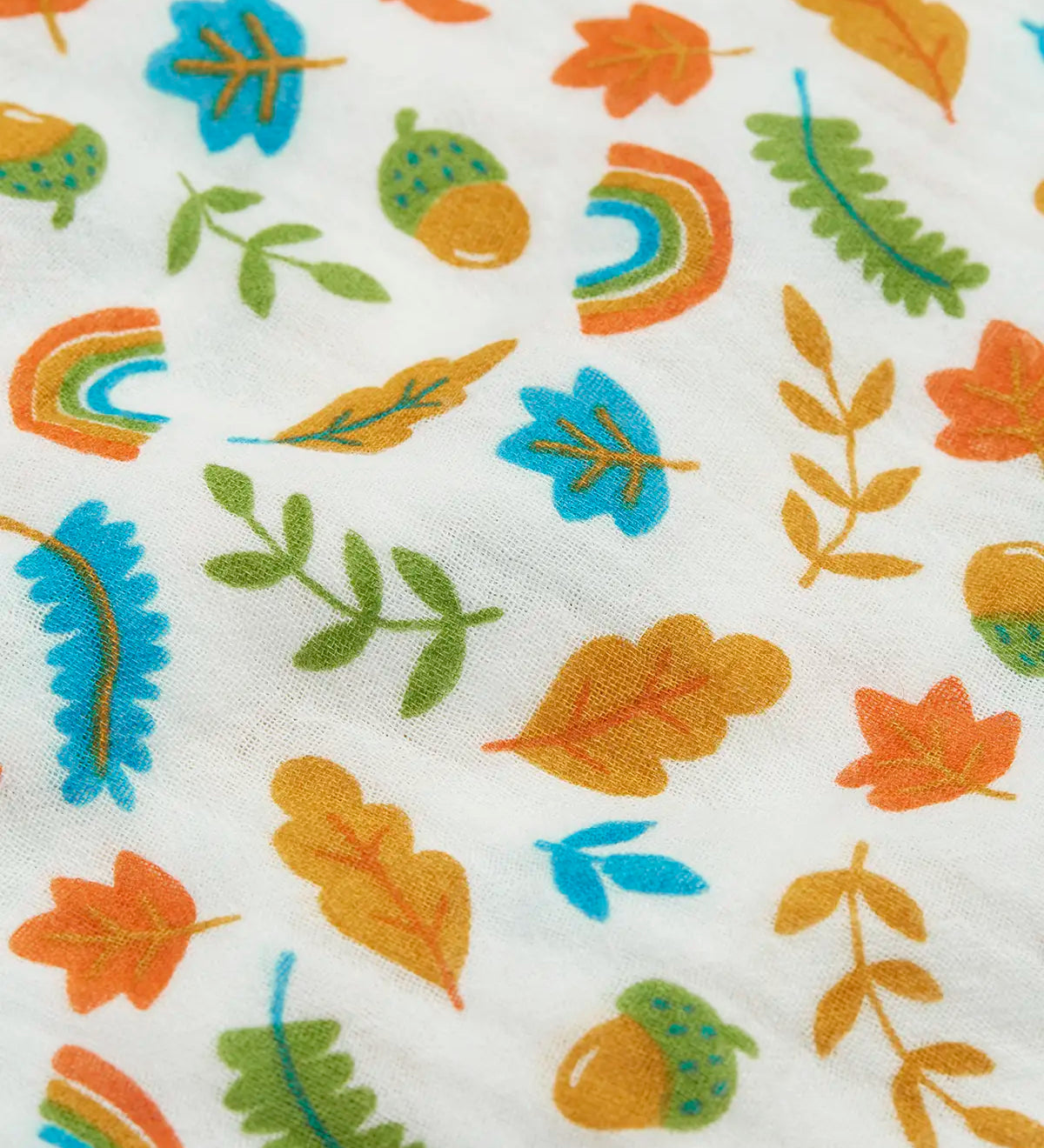 Close up of the autumn acorn print on the Frugi marvellous organic cotton muslin.
