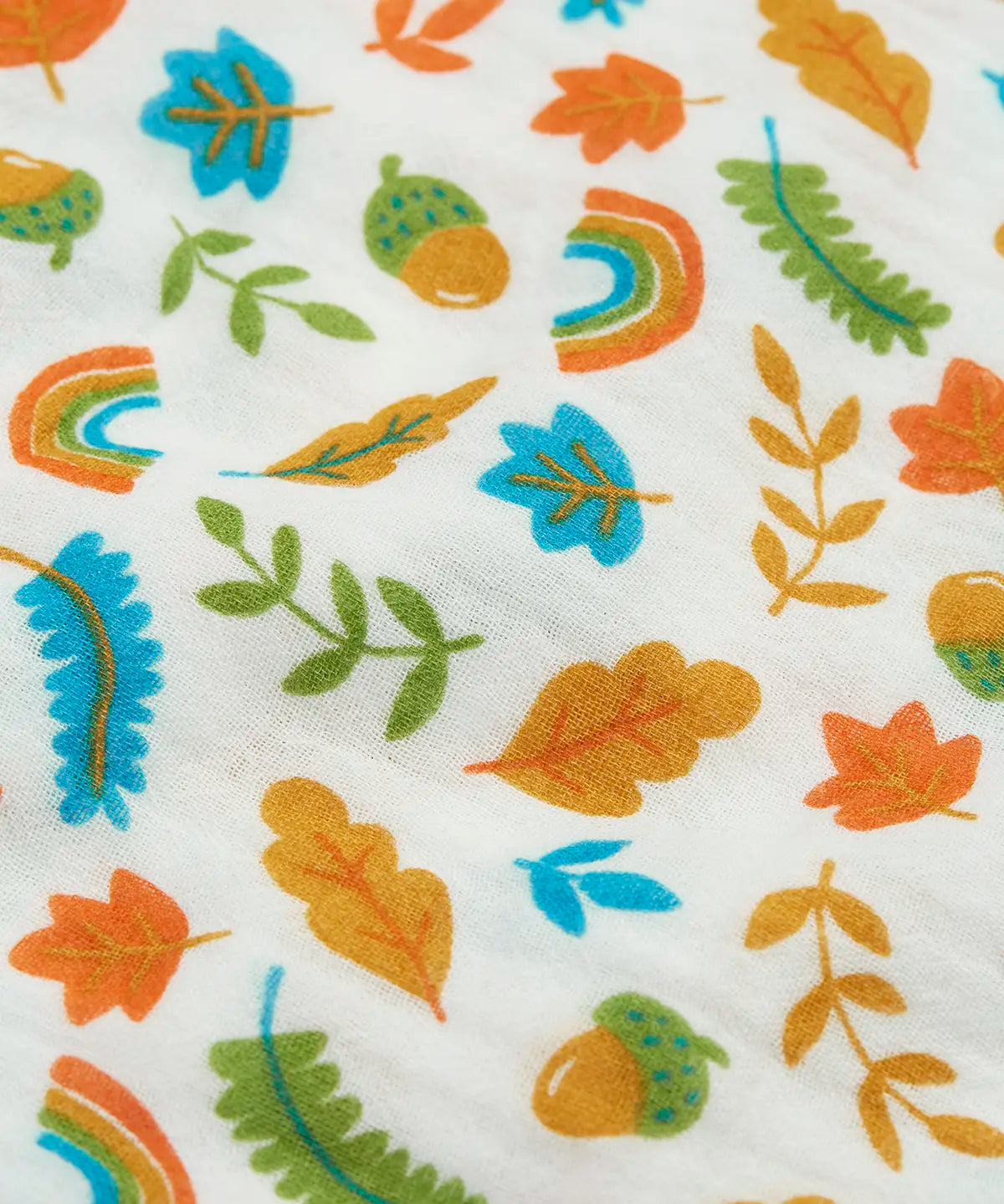Close up of the autumn acorn print on the Frugi marvellous organic cotton muslin.
