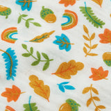 Close up of the autumn acorn print on the Frugi marvellous organic cotton muslin.
