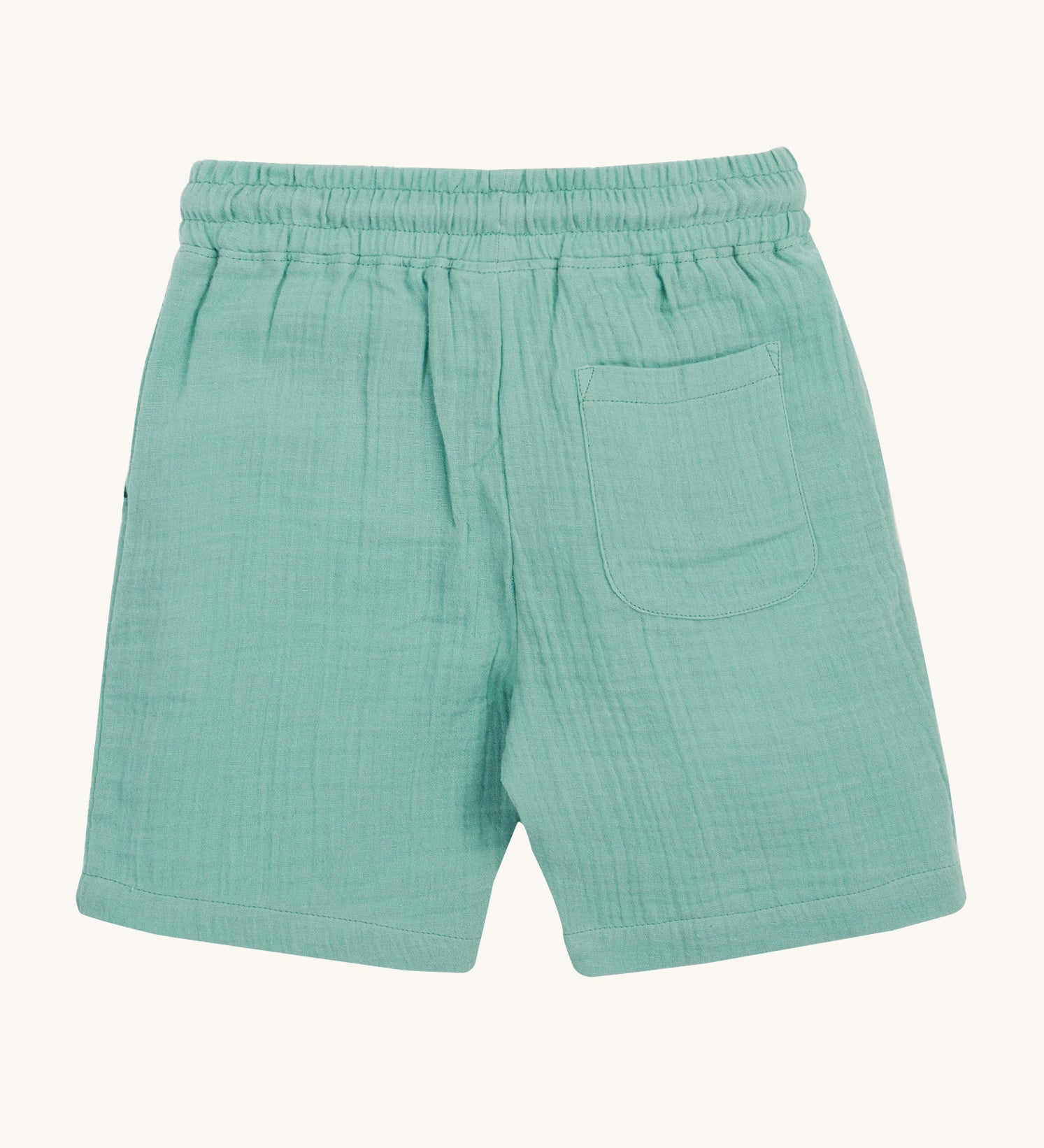 Frugi Mateo Shorts backward laid flat, in the colour Moss, featuring a back pocket.