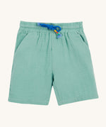 Frugi Mateo Shorts laid flat, in the colour Moss, featuring a blue drawstring and two front pockets.