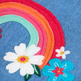 Close up of the rainbow and flower applique on the front of the Frugi mia organic cotton denim dungaree.