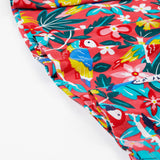 A close up of the bottom of Frugi Morwenna Skater Dress in the Birds Of Paradise print.