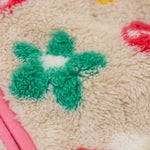 A close up of thick fleece detail on the Frugi mushroom field ted stripe fleece 