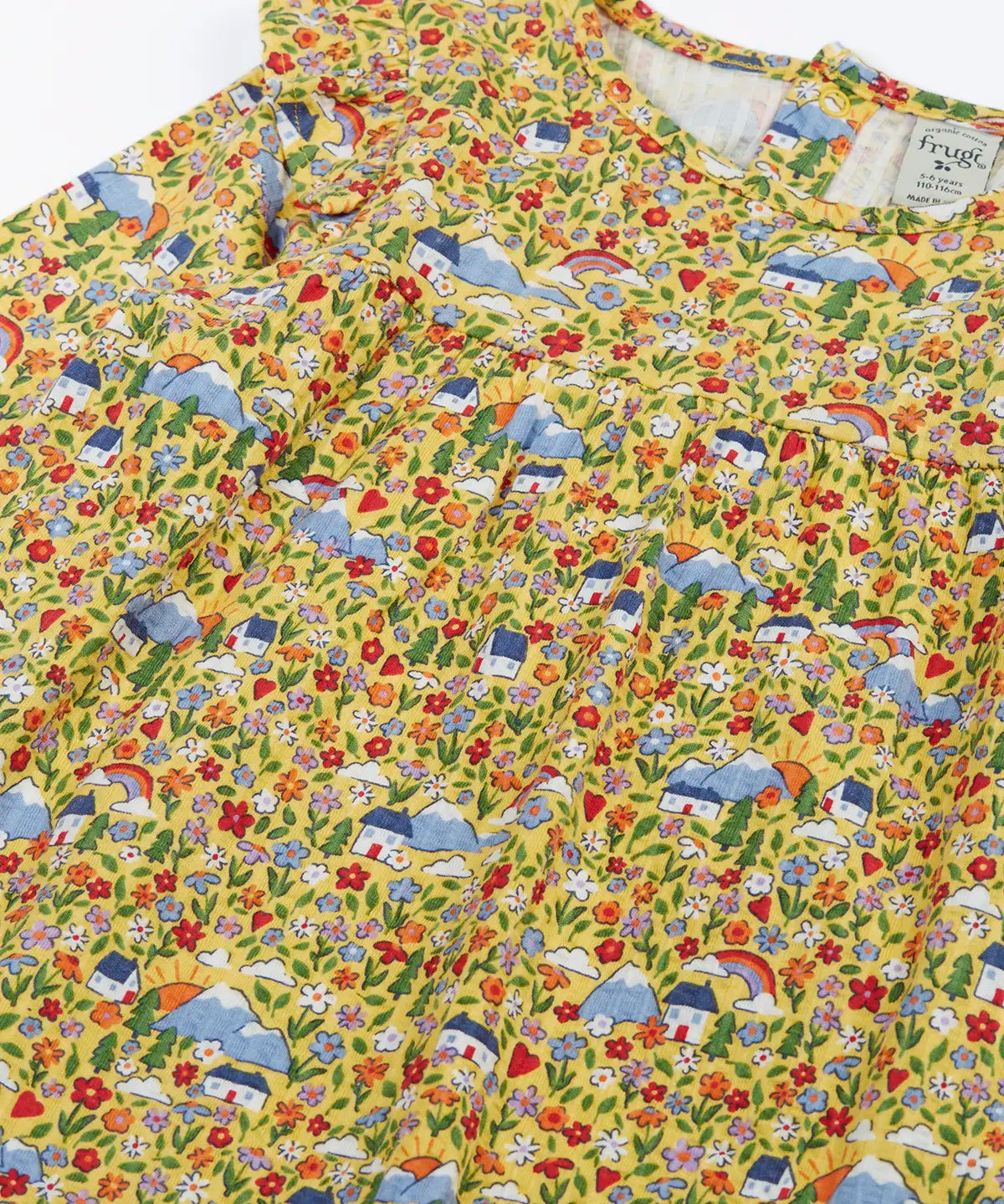 Frugi Natasha long sleeve organic cotton top in yellow with an all over highland houses themed print.