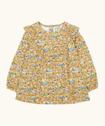 Frugi Natasha long sleeve organic cotton top in yellow with an all over highland houses themed print. Frilled collar and elasticated sleeves.