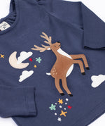 A close up of the front of the Frugi Navy Organic Cotton Caris Reindeer Applique Top. This top is a part of a wide range of organic cotton clothing for children available here at Babipur. 