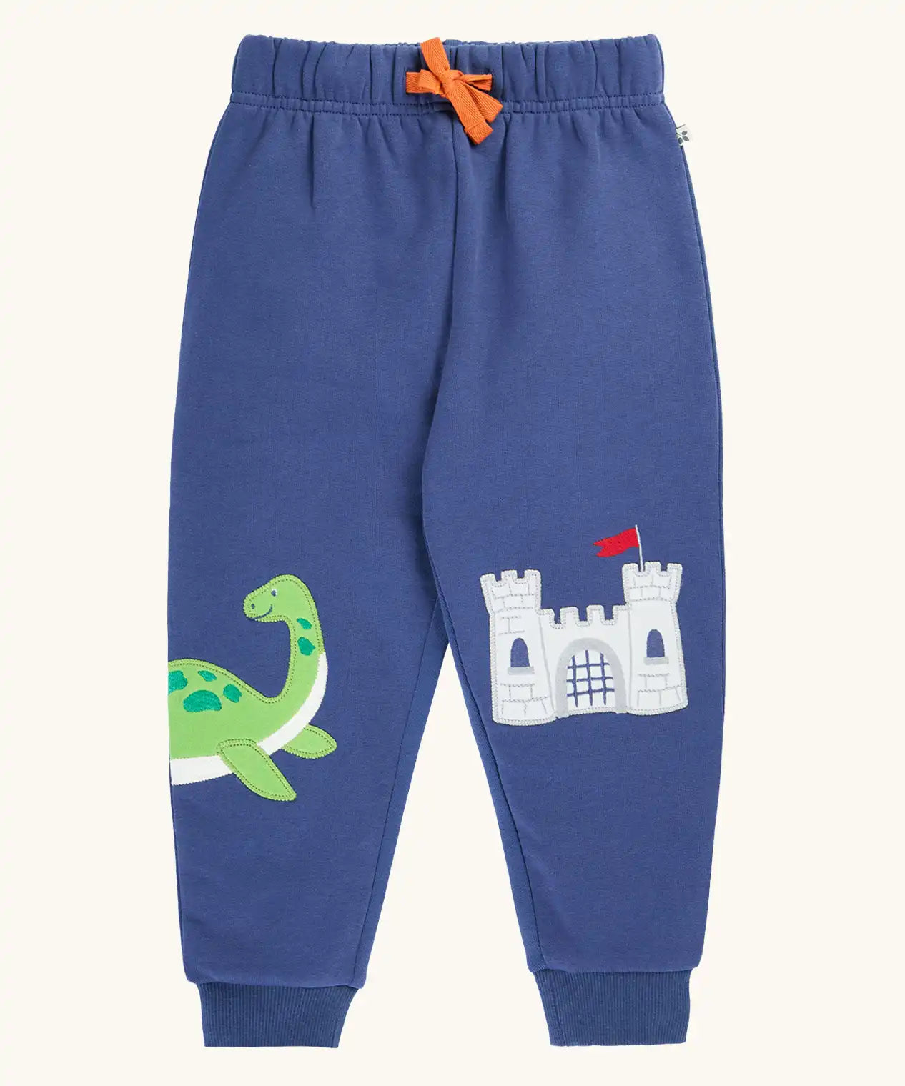 Frugi navy nessie organic cotton kids character joggers, green nessie on one side and castle on the other.