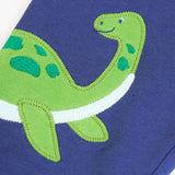 Close up of the green loch ness monster applique on the Frugi navy nessie organic cotton kids character joggers.