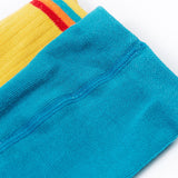 A close up of the waistbands on the Frugi Norah 2 pack tights, the mushroom design tights have a plain turquoise blue coloured waistband and teh bumblee yellow tights have a multi-coloured striped waistband.