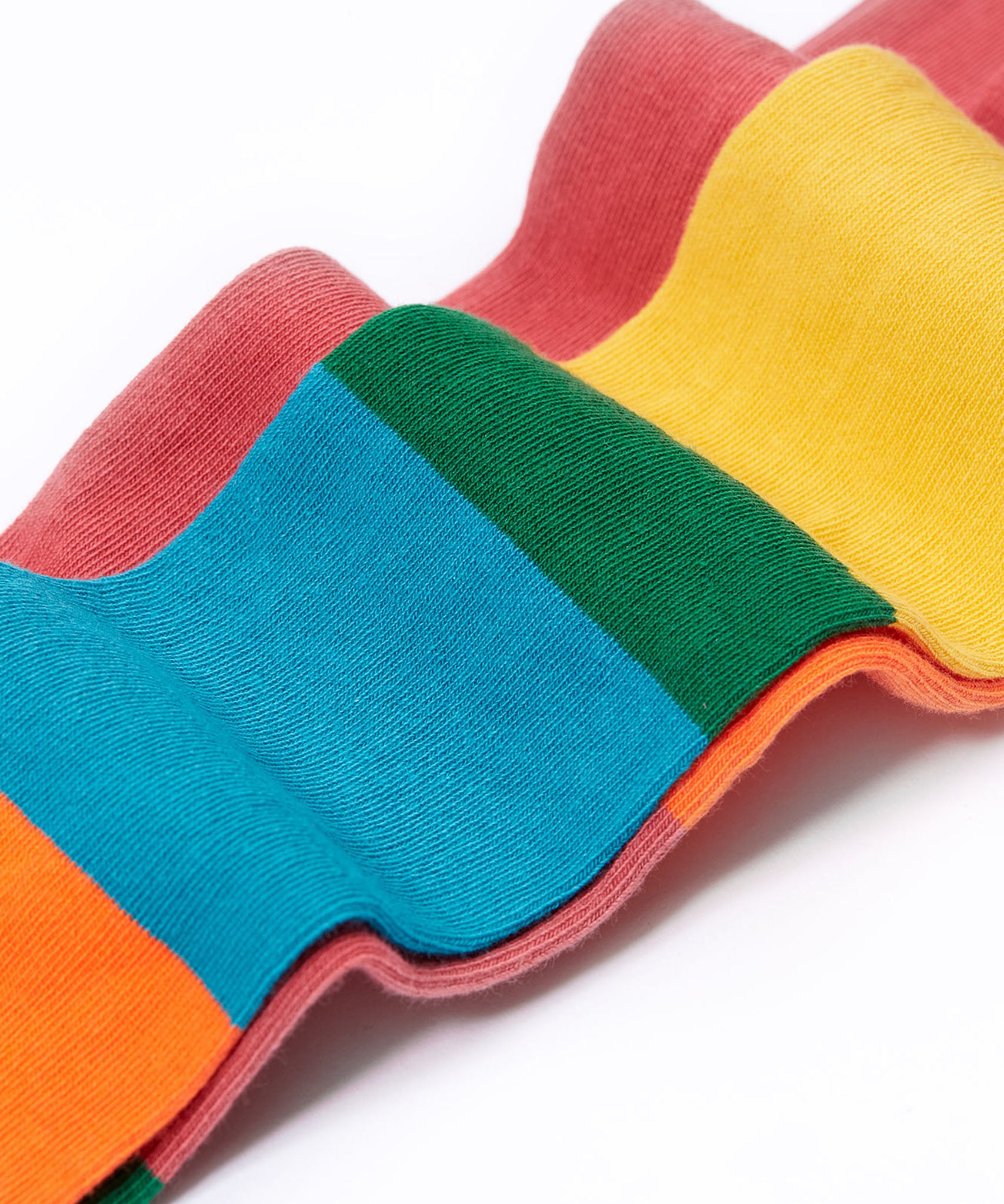 A close up of the material of the  Frugi Norah hotchpotch rose pink tights. The tights are made with skin-friendly organic cotton. 
