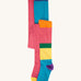 A 2 pack of Frugi Norah organic cotton footed kids tights. One pair has a multi-colour hotchpotch colour block design the other has a solid rose pink colour with multi-coloured waistband. 