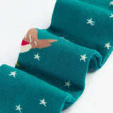 Close up of the Frugi Norah organic cotton knitted tights in hut green with robins. 