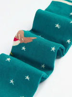 Close up of the Frugi Norah organic cotton knitted tights in hut green with robins. 